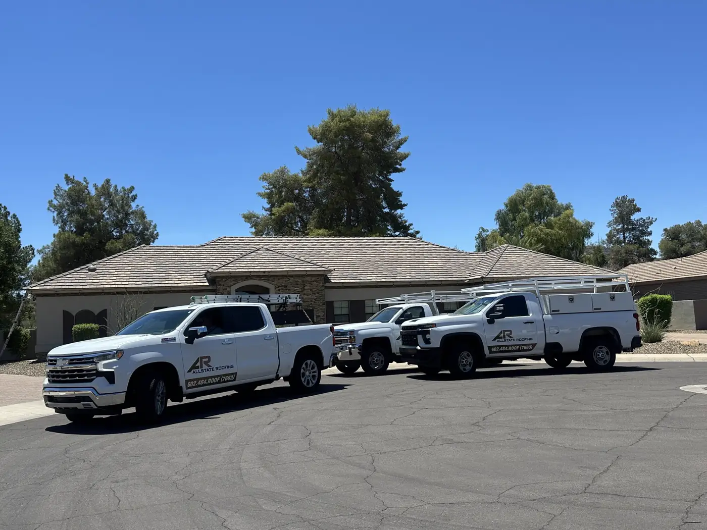 Allstate Roofing fleet trucks lined up in Arizona