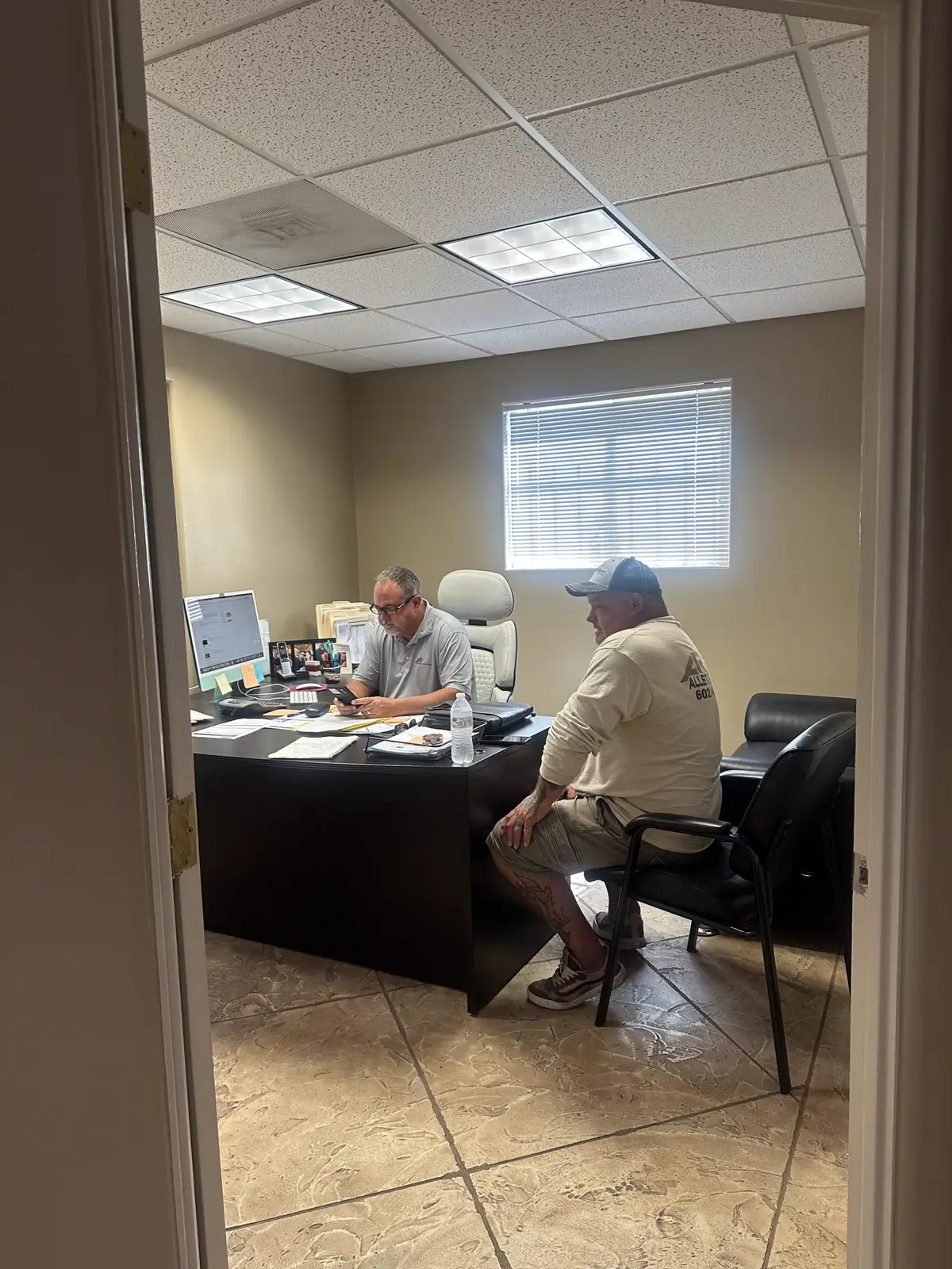 The Allstate Roofing office team at work in Phoenix