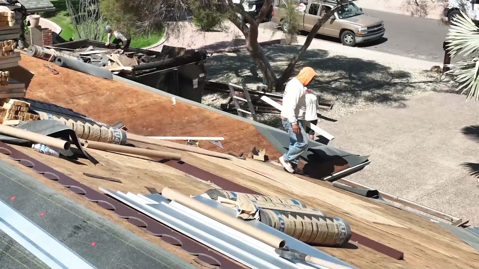 Aerial view of an Allstate Roofing tear-off in progress on a Phoenix home